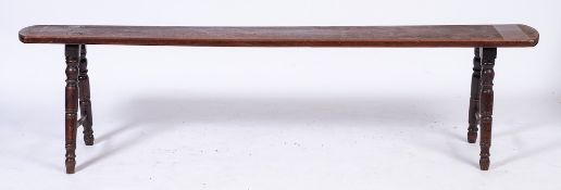An early 19th Century oak rectangular bench seat:, with rounded ends,