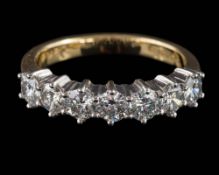 An 18ct gold and diamond seven-stone ring: set with round,