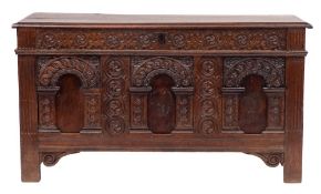 A late 17th Century oak rectangular coffer:, with a plain hinged moulded top,
