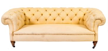 An Edwardian Chesterfield settee:, fully upholstered in yellow buttoned damask fabric,