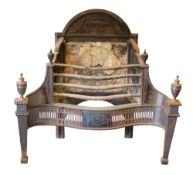 A cast iron and steel serpentine fronted basket fire grate in the Adam taste:,