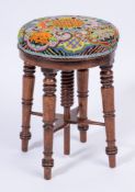 An early 19th Century mahogany circular revolving piano stool:,