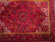 A Turkish carpet:, the wine field with a central geometric flowerhead pole medallion,