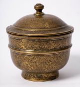 An Ottoman brass bowl and cover: engraved and chased overall with foliate cartouches on a ground of