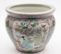 A Chinese porcelain jardinière: painted with panels of figures in garden settings on an ornate