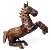 A Rajasthani sectional carved wood and polychrome decorated festival horse: in galloping pose,