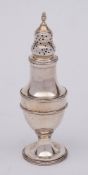 A George III silver sugar castor, maker Thomas Daniell, London 1785: crested, of baluster outline,
