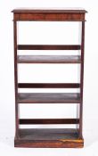 A 19th Century rosewood open bookcase:, of small size, with a moulded top on a plinth base,