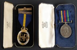 An Elizabeth II Army Emergency Reserve Decoration dated 1958 in case of issue: together with a