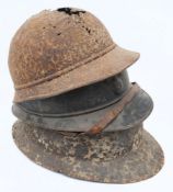 A WWI French Adrian pattern steel helmet: with attached comb and flaming grenade badge (no liner)