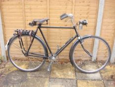 A 1920s Rudge bicycle: black frame with chrome plated handlebars, bar brakes,