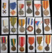 A collection of various world medals: including Spanish Military Cross, Serbian 1914-18 War Medal,