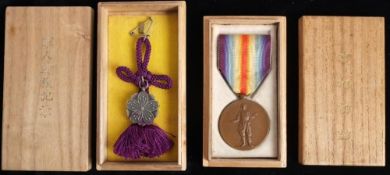 Two WWI Japanese Victory Medals in wooden cases of issue: (2)