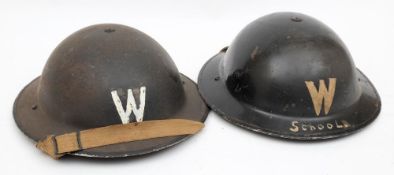 Two WWII Mk II pattern Warden's steel helmets: both with the letter 'W' to front,