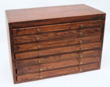 A scratch built stained pine table top collectors cabinet :of seven drawers with .