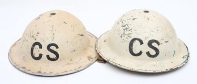Two WWII Home Front Mk II pattern steel helmets: both in white with the letters 'CS' to front,