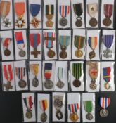A collection of French medals and orders: including a Combatant's cross,