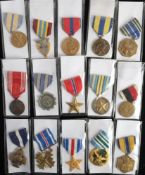 A group of fifteen various American Service medals: including a United States Naval Service medal.
