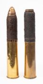 A pair of WWI 18pdr artillery shells with casings and fuses (2): (fuses loose)