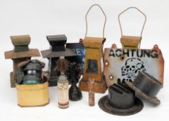 Two WWII period headlamp blackout shrouds,: together with four signal lamps, a child's gas mask,