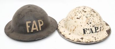 Two WWII MK II First Aid Party (FAP) steel helmets,: one in white,