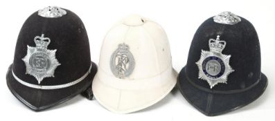 A New Zealand Police Force helmet: white Home Service pattern with silver plated helmet plate,