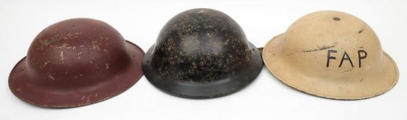 A WWII Mk II 2C style bakelite helmet: in black with liner and chinstrap,