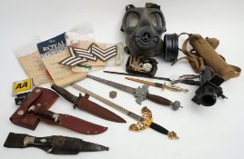 A group of miscellaneous militaria: including a gas mask, service books,