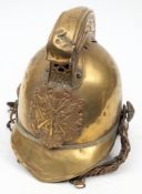 An early 20th century Merryweather pattern fireman's brass helmet: the comb with repouse dragon
