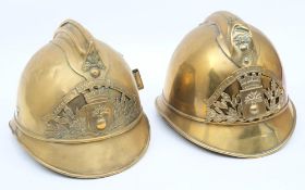 Two early 20th century French Fire Service brass helmets: for 'Indre et Loire' and 'De Germaine',