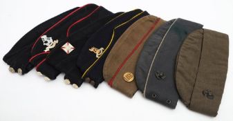A group of three American forage caps and four British forage caps.