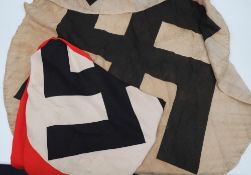 A WWII NSDAP cloth roundel:, 100cm diameter, together with a large NSDAP flag,