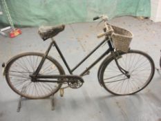A Raleigh all steel bicycle: step through frame with plated handlebars, bar brakes,