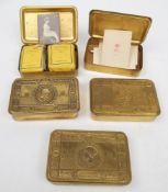 A group of five 1914 Christmas tins,: two with cigarettes and tobacco,
