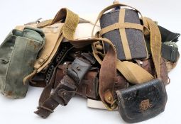 Two leather ammunition belts together with two Sam Browne belts and a collection of various canvas