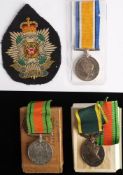 A WWI War Medal to '24669 Pte C Gibon Bord R': together with cloth badge,