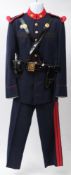 A Spanish Royal Guard uniform: comprising blue cloth tunic with red cloth collar and epaulettes,