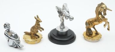 A reproduction Art Deco style car mascot in the form of a seated woman: together with a desk