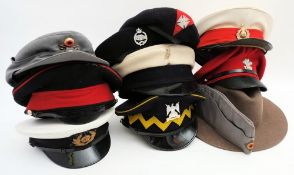A collection of various peaked caps: including Royal Marines, Royal Scots Dragoon guards and others.
