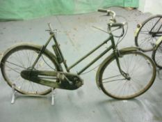 A Raleigh all steel bicycle: step through frame with plated handlebars, lever brakes,