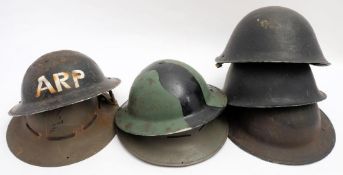 Two WWII period Zuckerman CPH (Civilian Protection Helmet) steel helmets,