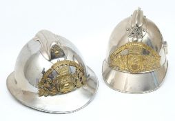 Two early 20th century French Fire Service polished steel and brass helmets: for 'D Eguisses' and