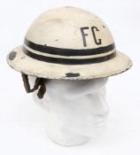 A WWII Fire Guard Sector Captain Mk II pattern steel helmet: white with letters 'FG' front and back