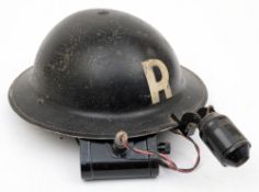 A WWII Mk II Rescue/Report steel helmet with black lacquered brass blackout lamp: the helmet with