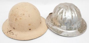 A mid 20th century American Civil Defence steel helmet/sun hat:, white with canvas strap liner,