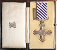 A George V Distinguished Flying Cross: dated 1945 together in box of issue in a display case,