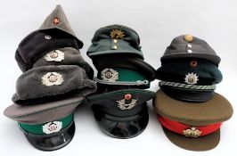 A collection of eleven various Russian & Eastern European military caps and hats: (a lot)