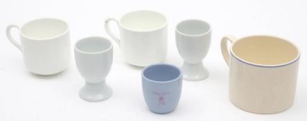 Three WWII pattern Kriegsmarine egg cups: together with a RAF pattern Officer's mess mug and two