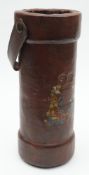 A brown leather charge/shot bucket: with remains of transfer armorial to front,
