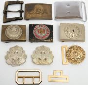 A group of foreign belt buckles and a reproduction German belt buckle: